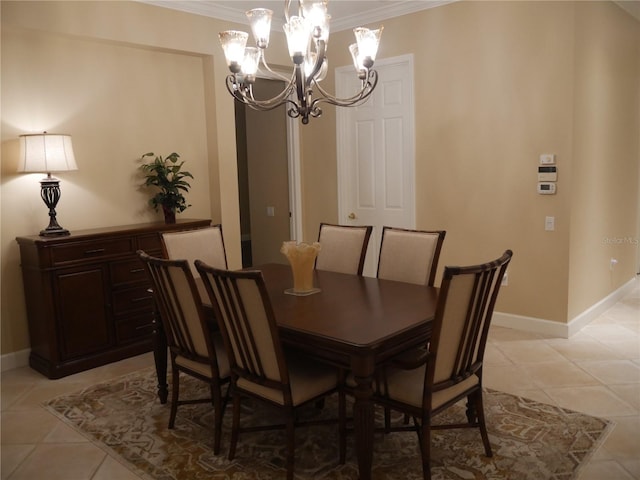 dining space featuring a notable chandelier, light tile patterned floors, and crown molding