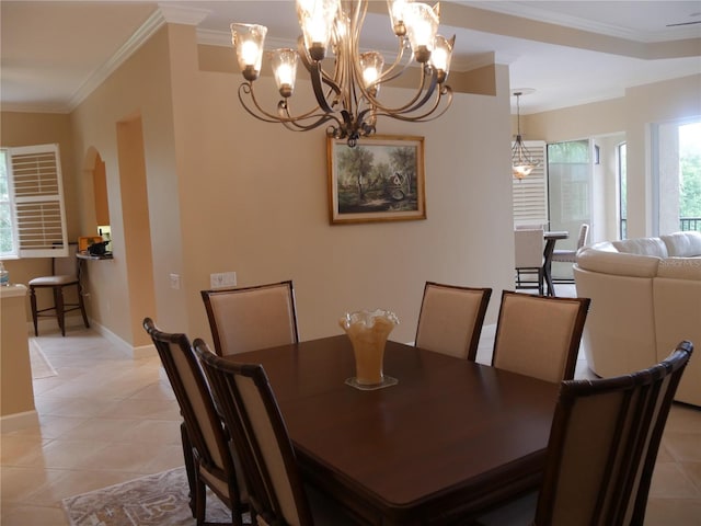 dining space with light tile patterned flooring and ornamental molding