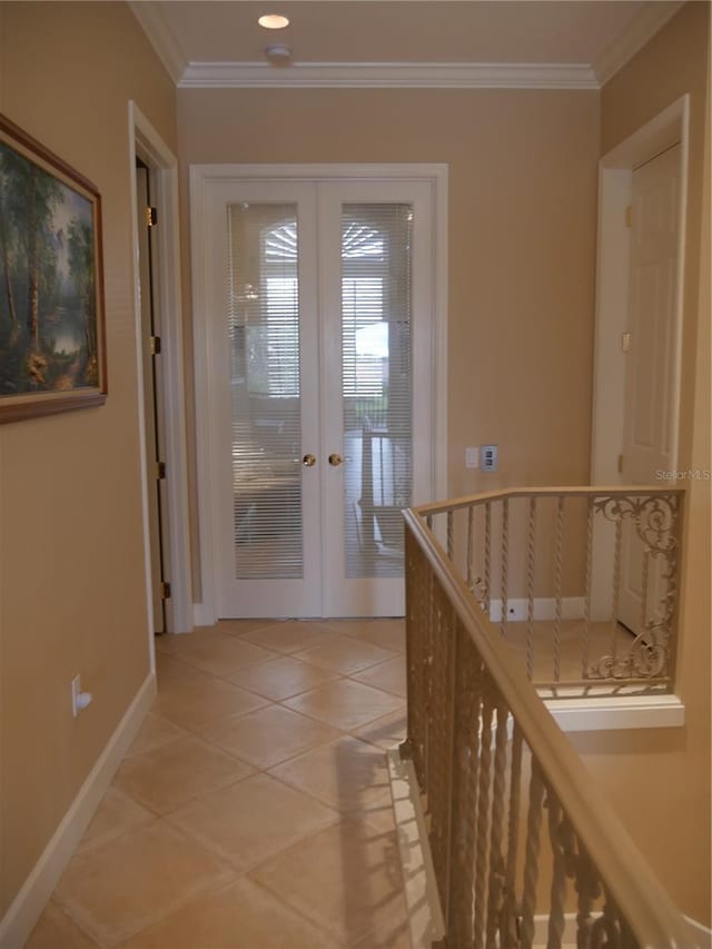 corridor featuring tile patterned flooring, french doors, and ornamental molding