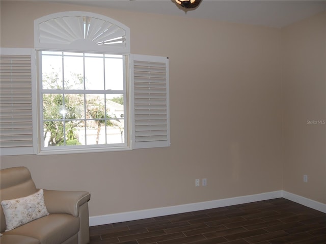 sitting room with dark hardwood / wood-style flooring