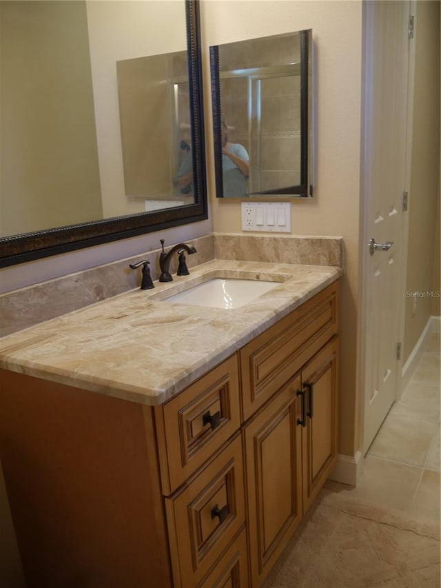 bathroom featuring vanity and tile patterned flooring