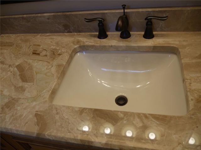 interior details with sink and tasteful backsplash