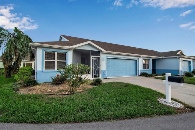 single story home with a front lawn and a garage