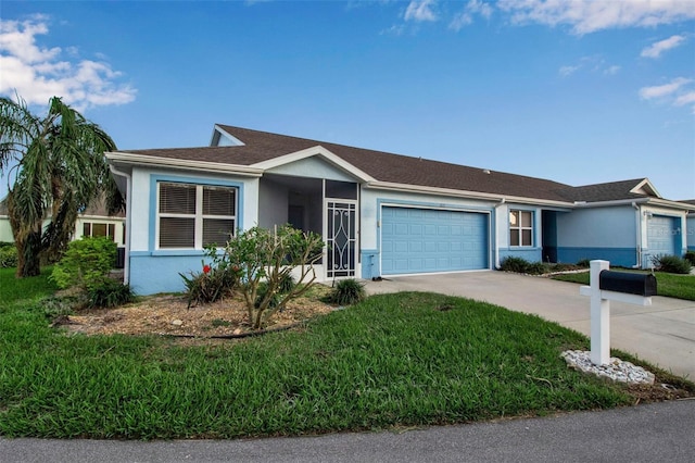 3115 Live Oak Ln Unit 30, Palmetto, FL 34221 - ranch-style home featuring stucco siding, a garage, driveway, and a front lawn