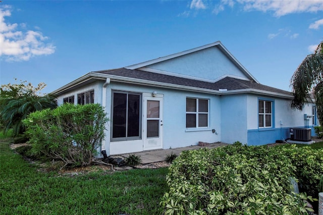 3115 Live Oak Ln Unit 30, Palmetto, FL 34221 - rear view of house with stucco siding and central AC unit
