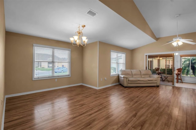 unfurnished living room with plenty of natural light, wood-type flooring, and lofted ceiling