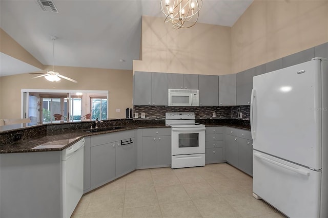 kitchen featuring white appliances, ceiling fan with notable chandelier, gray cabinets, decorative light fixtures, and light tile patterned flooring