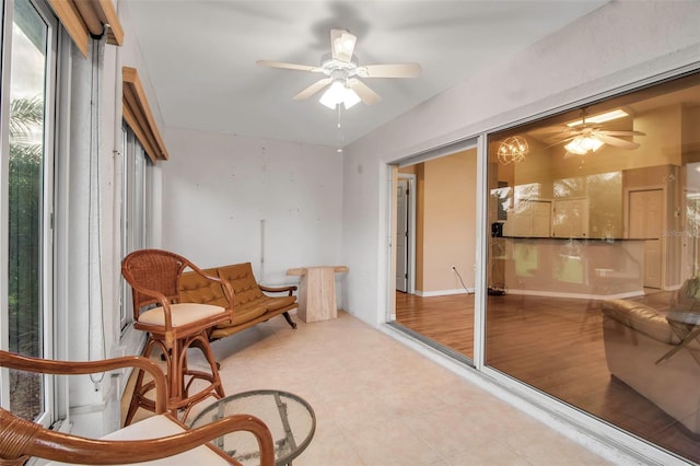 sitting room featuring ceiling fan and light hardwood / wood-style flooring