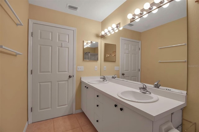 bathroom featuring tile patterned flooring and vanity