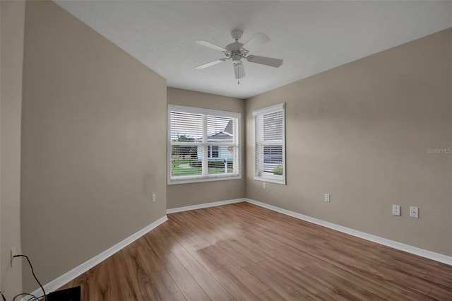 unfurnished room with ceiling fan and light hardwood / wood-style flooring