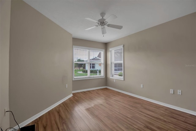 3115 Live Oak Ln Unit 30, Palmetto, FL 34221 - empty room with wood finished floors, baseboards, and a ceiling fan