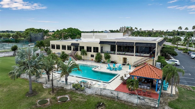 3115 Live Oak Ln Unit 30, Palmetto, FL 34221 - rear view of house with stairs, a gazebo, a patio, and a community pool