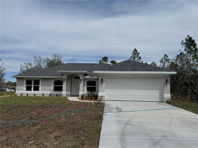 ranch-style house with a shingled roof, concrete driveway, an attached garage, and stucco siding