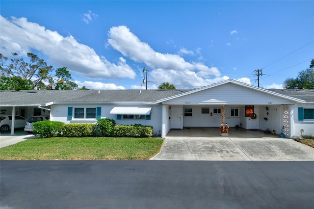 single story home featuring a front yard and a carport