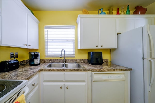 kitchen featuring white cabinets, sink, and white appliances