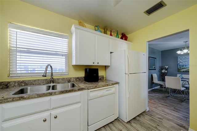 kitchen featuring light hardwood / wood-style floors, sink, white appliances, a chandelier, and white cabinets