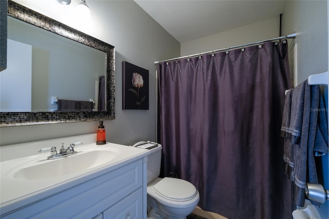 bathroom with walk in shower, vanity, and toilet
