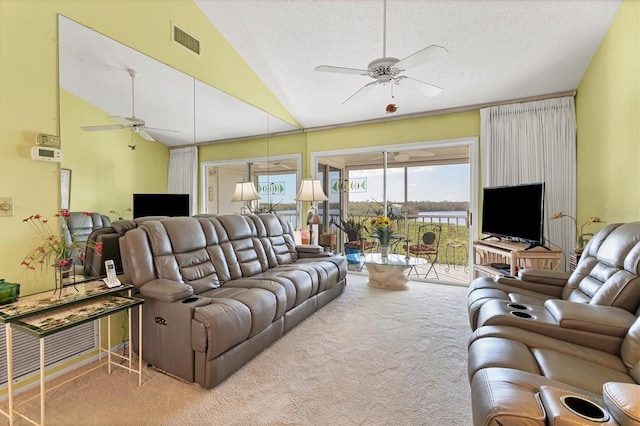 living room featuring carpet floors, vaulted ceiling, a textured ceiling, and ceiling fan