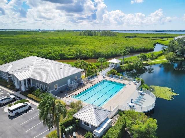 birds eye view of property with a water view