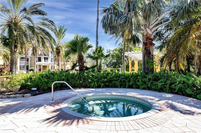 view of pool featuring a hot tub