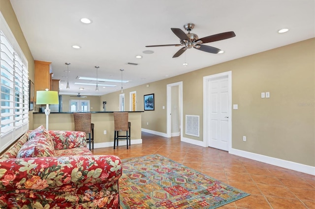 living room with light tile patterned floors