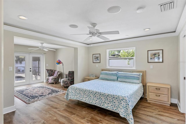 bedroom featuring ceiling fan, french doors, and hardwood / wood-style flooring