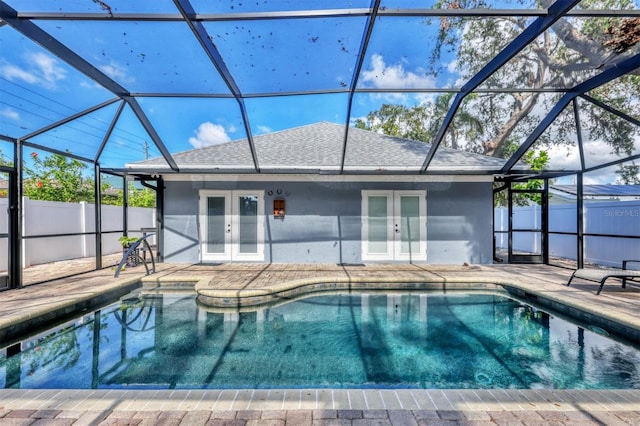 view of pool featuring french doors, a patio, and a lanai