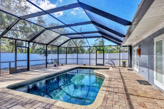 view of pool with a lanai and a patio