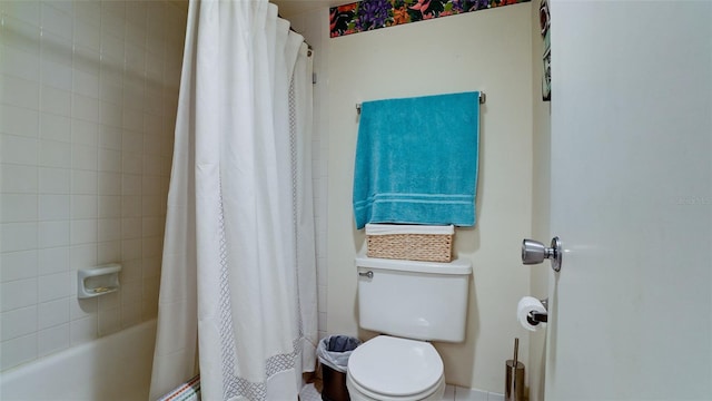 bathroom with shower / bath combo and toilet