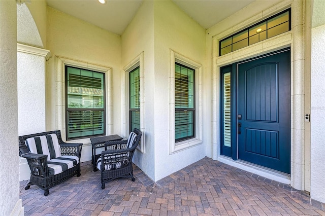 entrance to property featuring covered porch