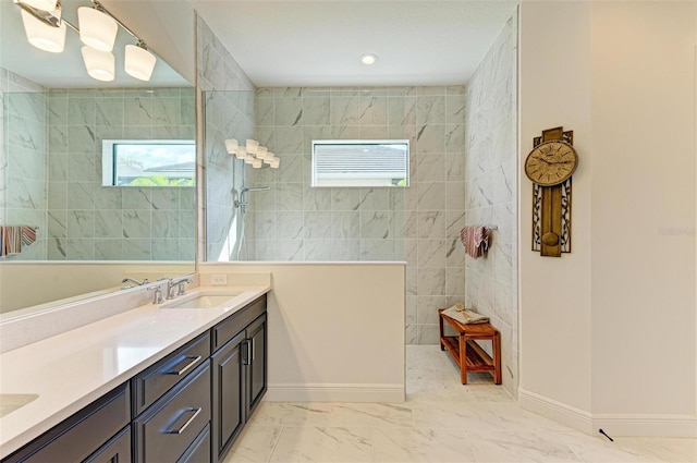 bathroom featuring vanity and tiled shower