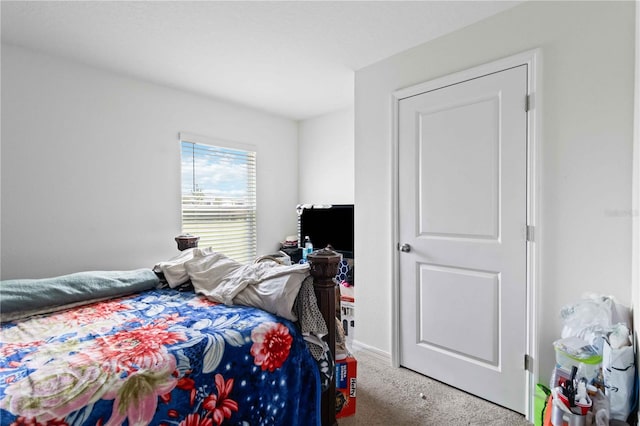 bedroom featuring light colored carpet