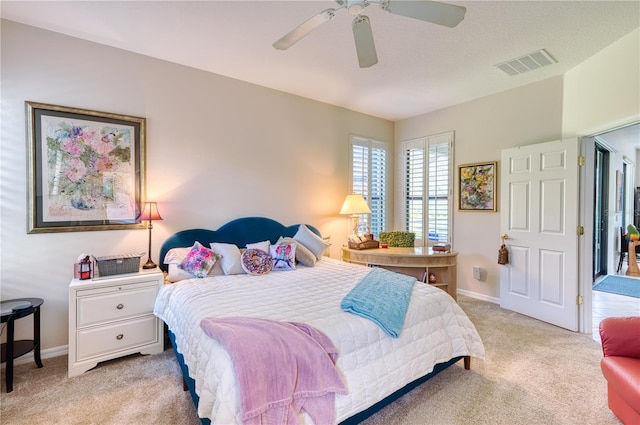 carpeted bedroom with ceiling fan