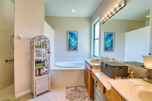 bathroom with tile patterned flooring, vanity, and separate shower and tub