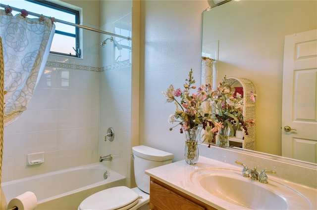 full bathroom featuring vanity, shower / bath combo, and toilet