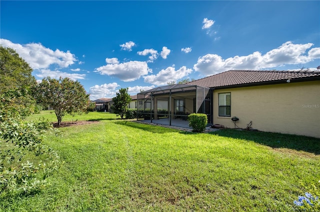 view of yard with a lanai