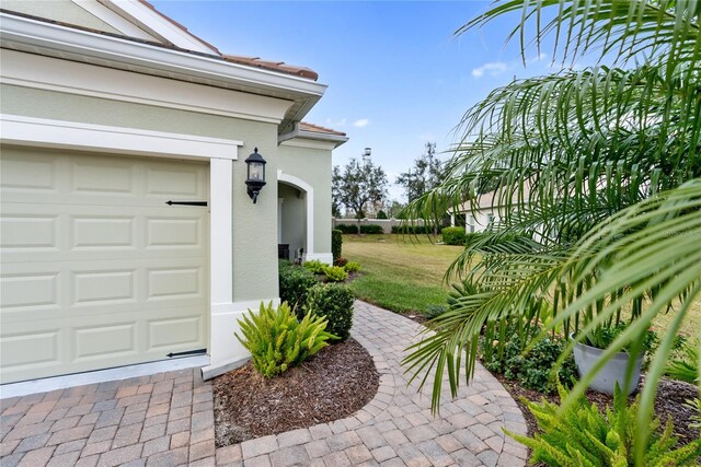 exterior space with a lawn and a garage