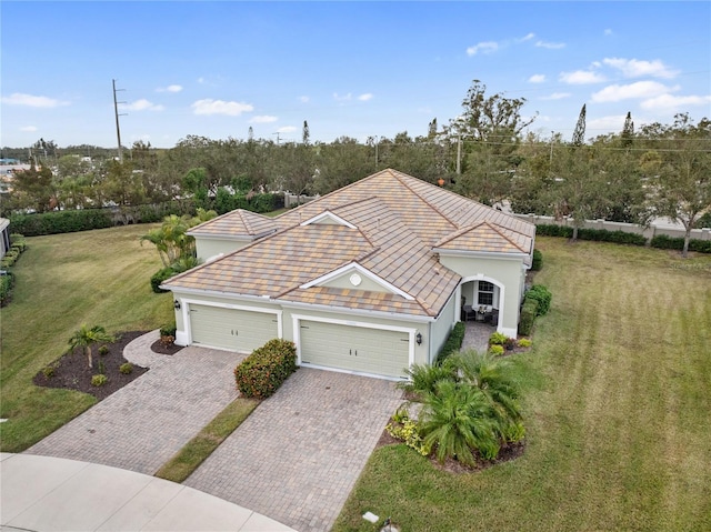 view of front of house with a front yard and a garage