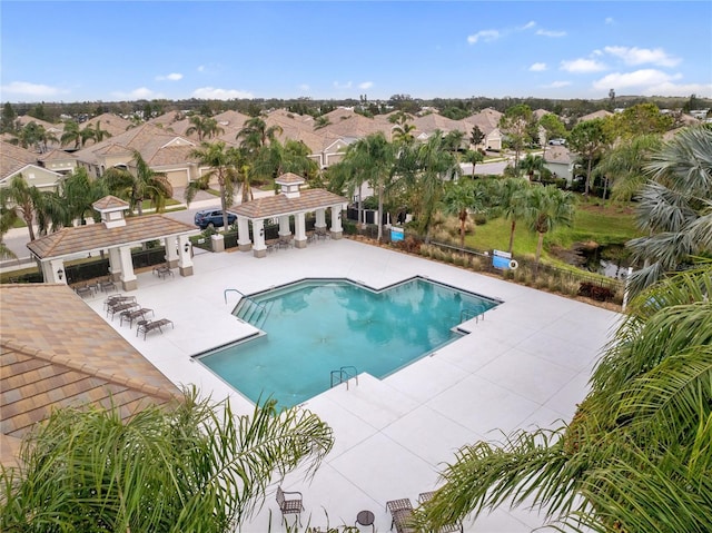 view of pool featuring a patio and an outdoor structure