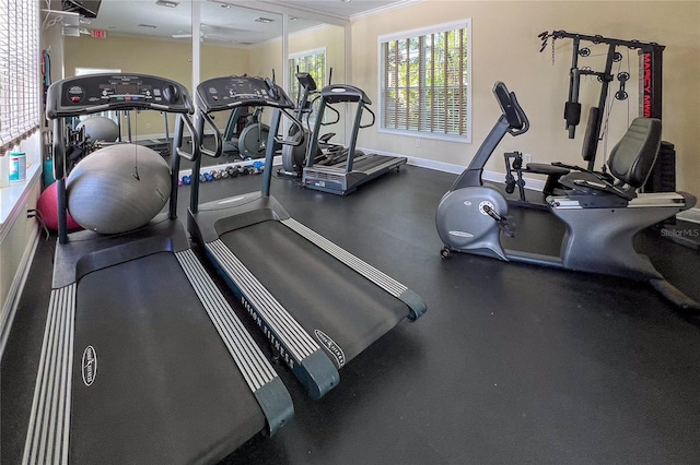 exercise room featuring ornamental molding