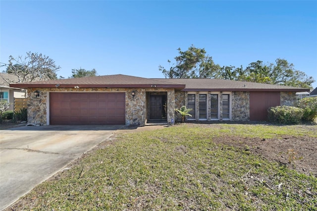 ranch-style house with a garage and a front yard