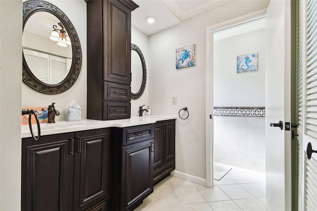 117 Hillcrest Dr, Bradenton, FL 34209 - bathroom featuring double vanity, a sink, tile patterned floors, and ornamental molding