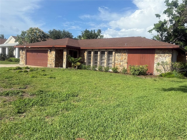 117 Hillcrest Dr, Bradenton, FL 34209 - view of front of house featuring stone siding, a garage, a front yard, and driveway