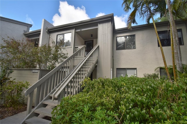 1508 Pelican Cove Rd Unit Gr233, Sarasota, FL 34231 - view of front of house featuring stairs and stucco siding