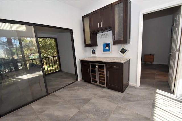 1508 Pelican Cove Rd Unit Gr233, Sarasota, FL 34231 - indoor dry bar featuring beverage cooler, light tile patterned floors, and baseboards