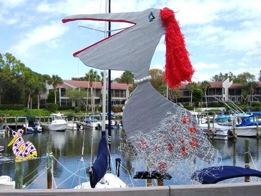 1508 Pelican Cove Rd Unit Gr233, Sarasota, FL 34231 - dock featuring a water view