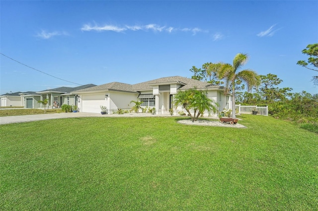 view of front of home with a garage and a front yard