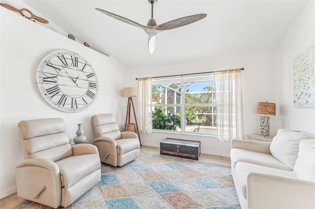 tiled living room featuring ceiling fan