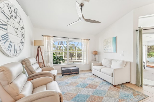 living room featuring light tile patterned floors, ceiling fan, and lofted ceiling