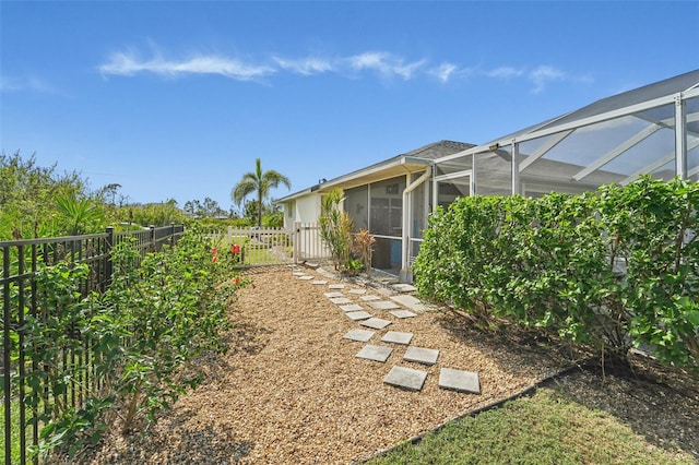 view of yard with a lanai